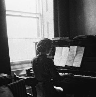 Wilhelmina Barns-Graham playing piano.