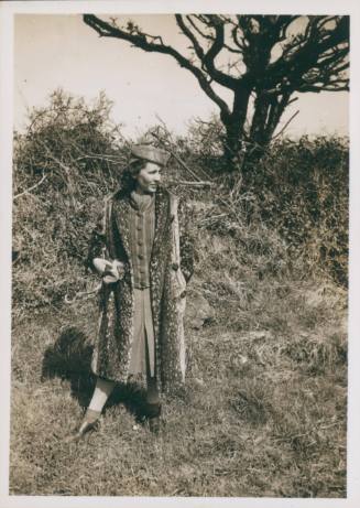 Wilhelmina Barns-Graham in fur coat and hat, in field.