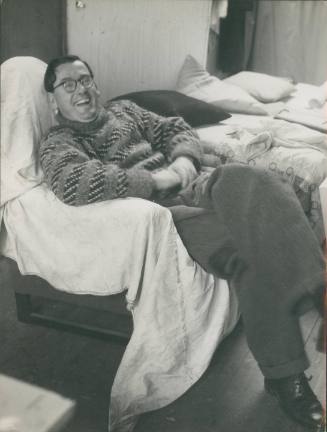David Lewis on sofa in No. 1 Porthmeor Studios. December 1954