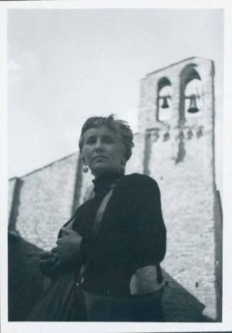 WBG in front of San Domenico Church, Arezzo. She is close to the camera and blocks the view of the entrance entirely.