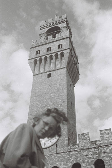 The Palazzo Vecchio, Florence, with WBG looking down at the camera and frowning