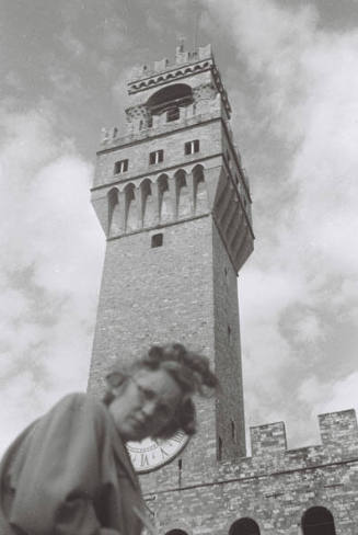 The Palazzo Vecchio, Florence, with WBG looking down at the camera and frowning