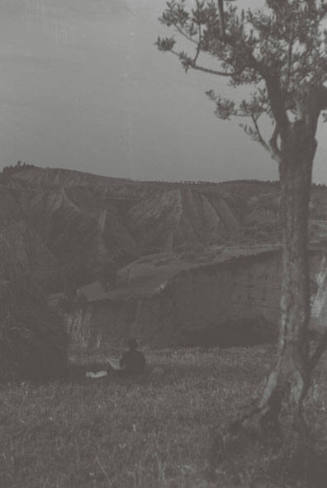 WBG in shadow, sitting and drawing the clay cliffs at Chiusure