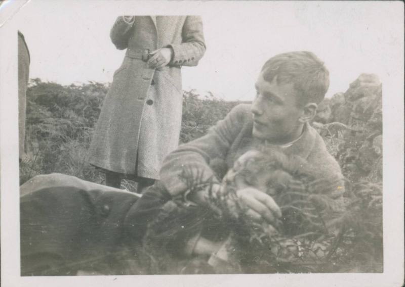 Wilhelmina Barns-Graham and Patrick Barns-Graham lying in grass