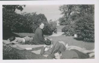 Group sitting on lawn of Ardcraig, Carradale. Edwin Lucas in centre.