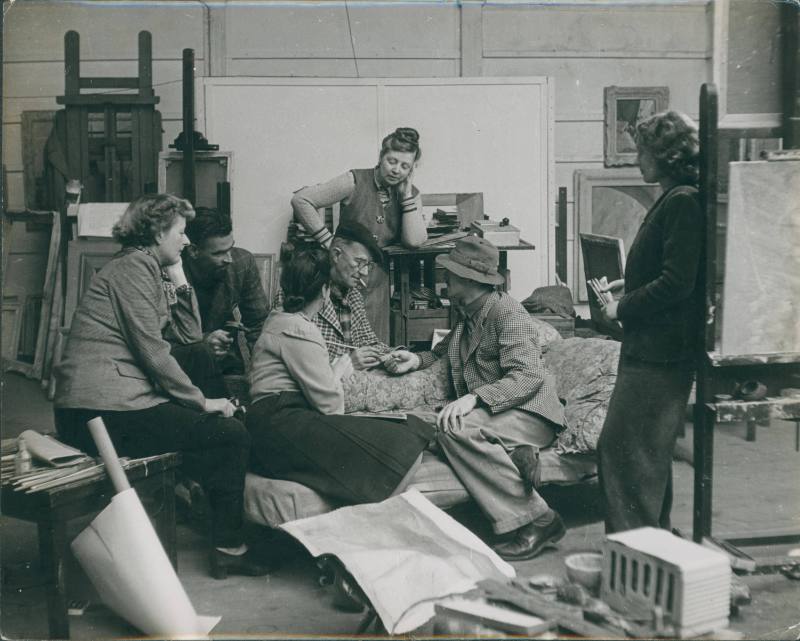 Possibly Penwith society meeting at No.1 Porthmeor Studios. Wilhelmina Barns-Graham holding paintbrushes.