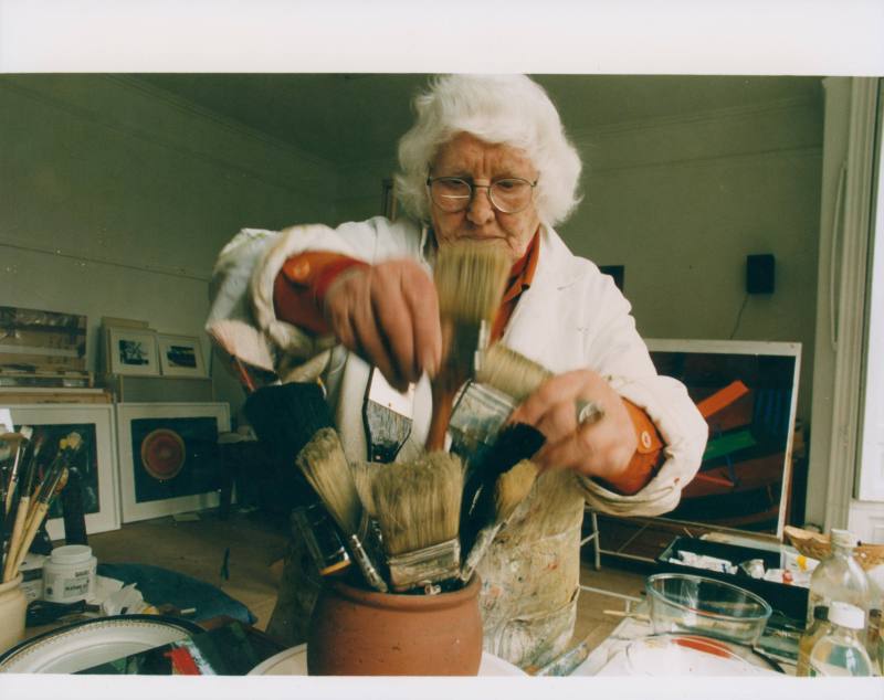 Wilhelmina Barns-Graham in Balmungo studio sorting paintbrushes.