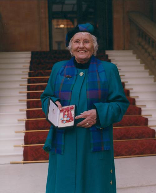 Wilhelmina Barns-Graham outside Buckingham Palace. [CBE]