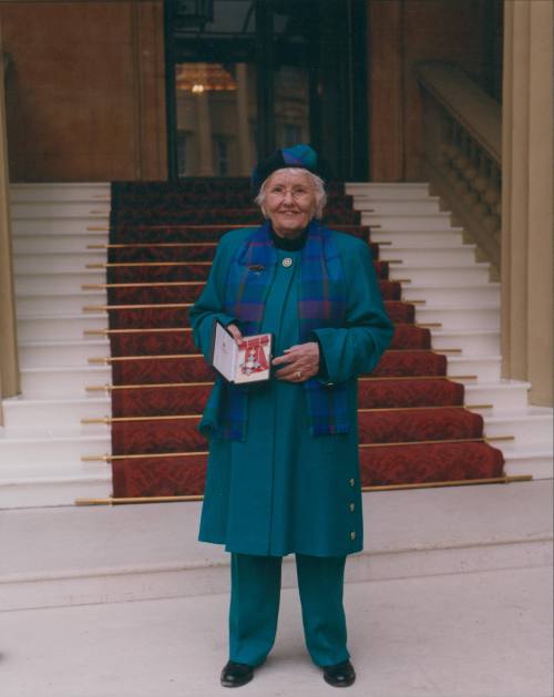 Wilhelmina Barns-Graham outside Buckingham Palace. [CBE]